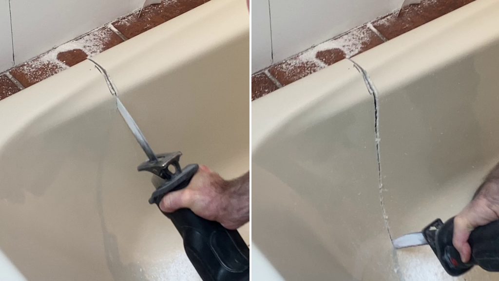 Cutting out old acrylic bathtub with reciprocating saw